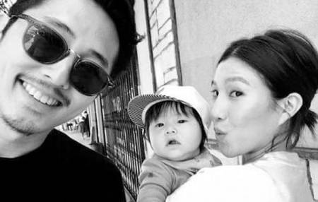 Steven Yeun with wife and son